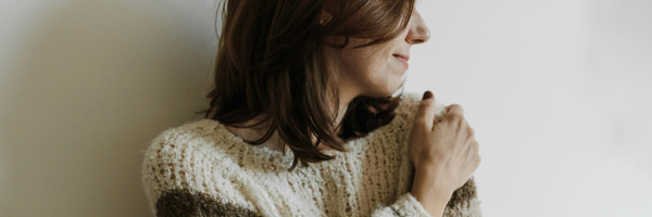 a woman hugging herself